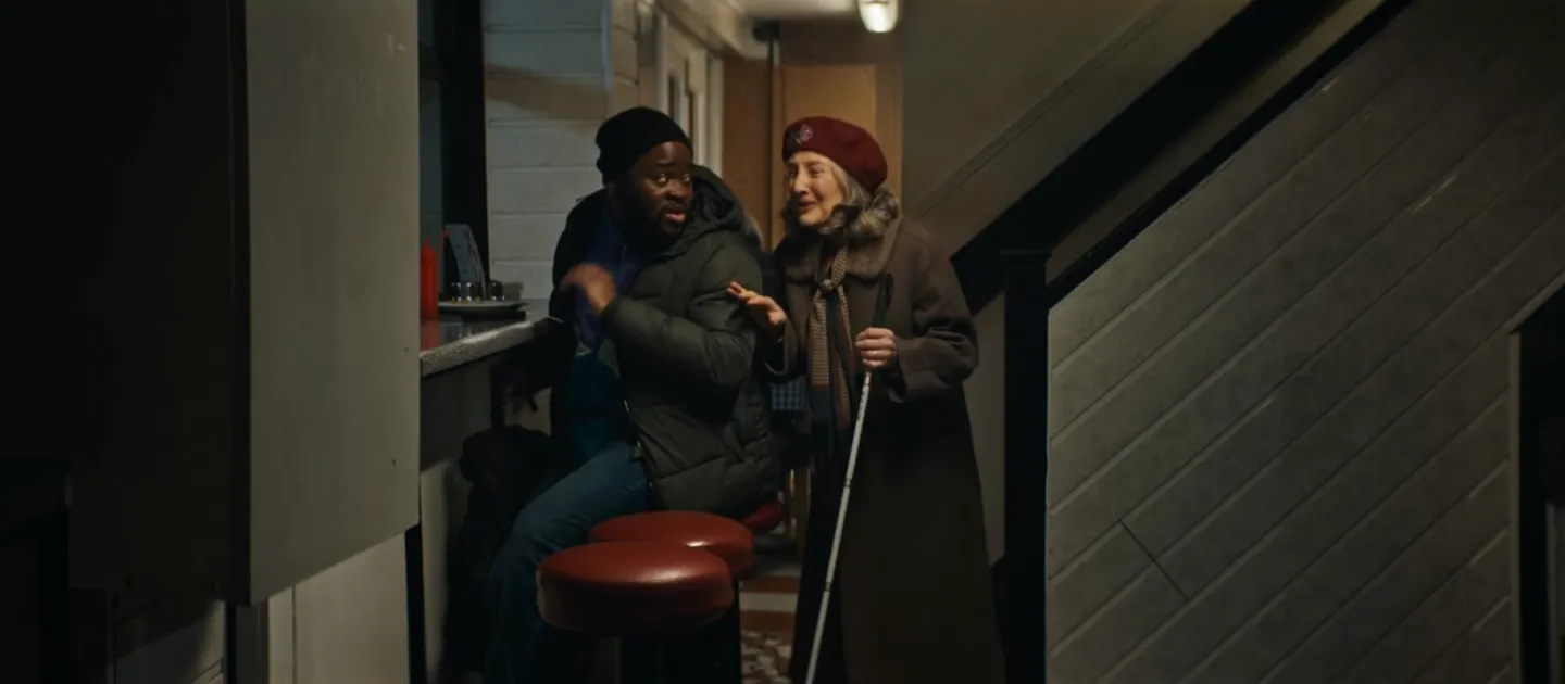 ROOM TAKEN image, blind woman passes a homeless man in cafe