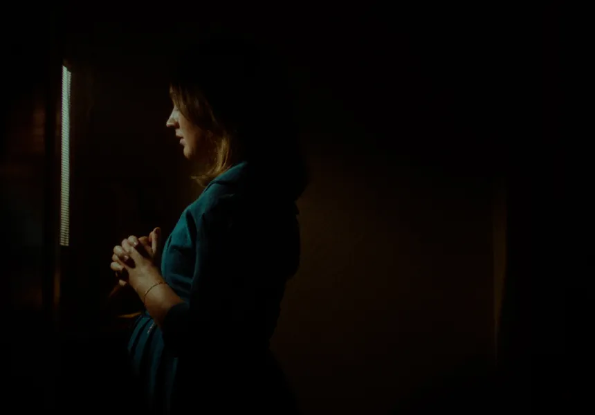 TESTIMONY main image, pregnant woman looking away