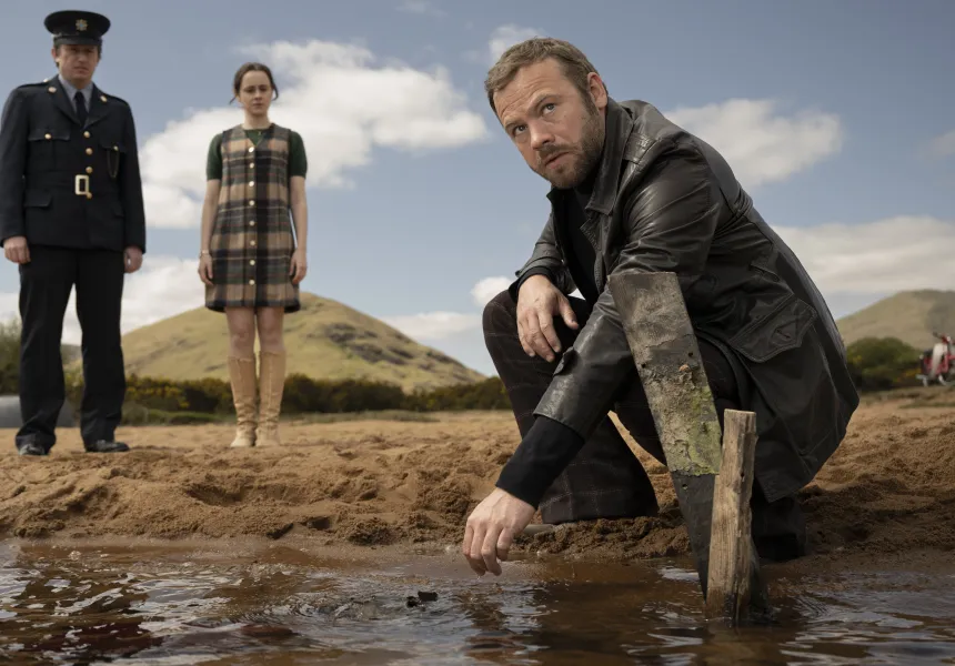 BAITE MAIN IMAGE - man kneeling near camera