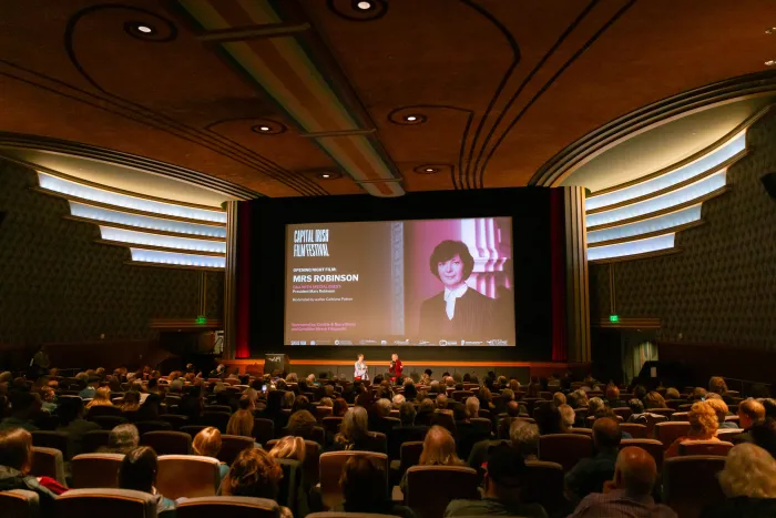 full theatre with photo of Mary Robinson on screen CIFF2025